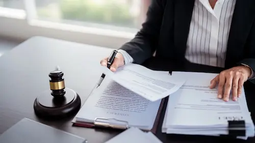 North Carolina car accident lawyer at NC Car Accident Lawyers reviewing a police accident report to identify errors and build a personal injury claim for an injured driver