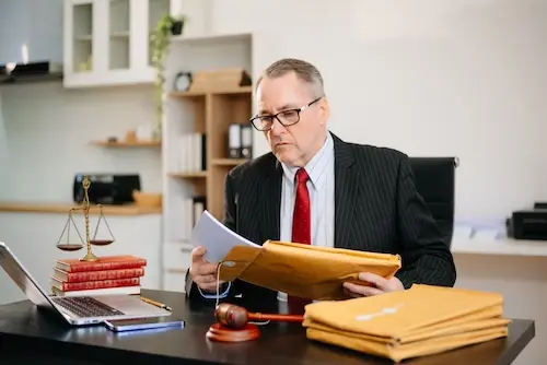 North Carolina truck accident lawyer at NC Car Accident Lawyers reviewing a commercial vehicle accident case file to build a claim for an injured driver in NC