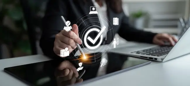 Insurance adjuster verifying claim approval and calculating insurance settlement values for the car accident victim's compensation.