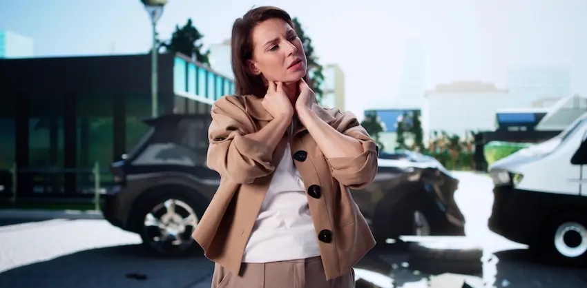 The accident injury recovery process begins as the victim experiences neck pain following a parking lot collision.
