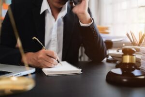 NC car accident attorney negotiating higher settlement with insurance company on behalf of injured client