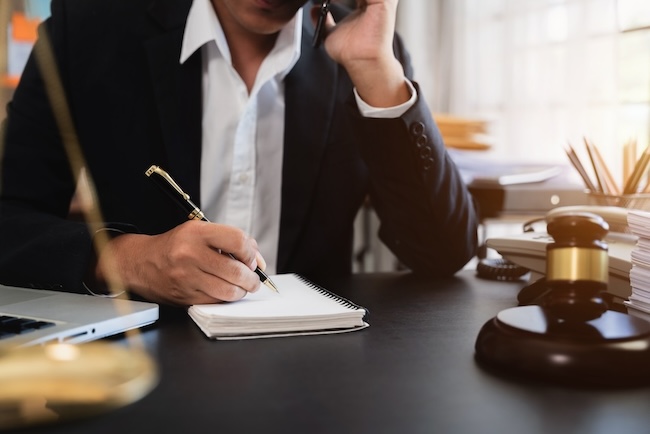 NC car accident attorney negotiating higher settlement with insurance company on behalf of injured client