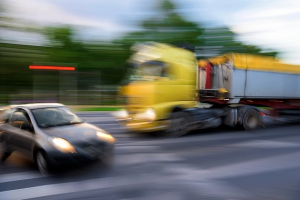 Semi-truck colliding with a passenger car — NC Car Accident Lawyers represent truck accident victims in these types of cases.