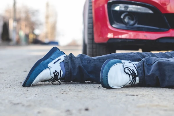 A man lies in the road after a pedestrian accident in Charlotte.